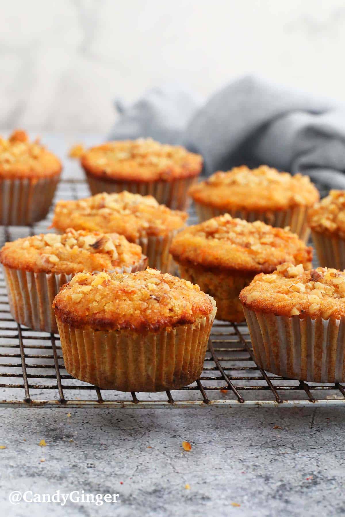 baked carrot muffins placed on a wire rack.