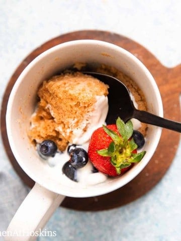 white mug with microwave oats mug cake.