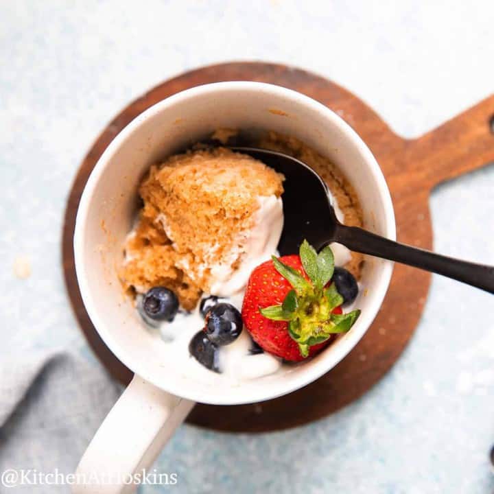 white mug with microwave oats mug cake.