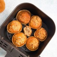 baked banana muffins in air fryer basket.