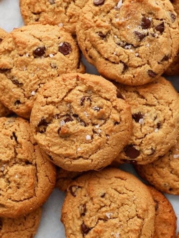 brown chocolate chip cookies placed on a white board.