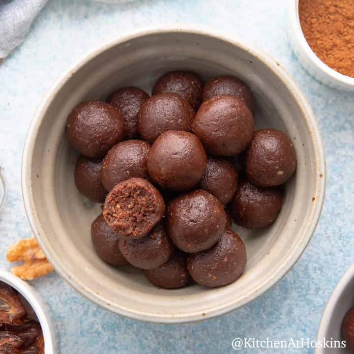 chocolate date balls in a bowl.