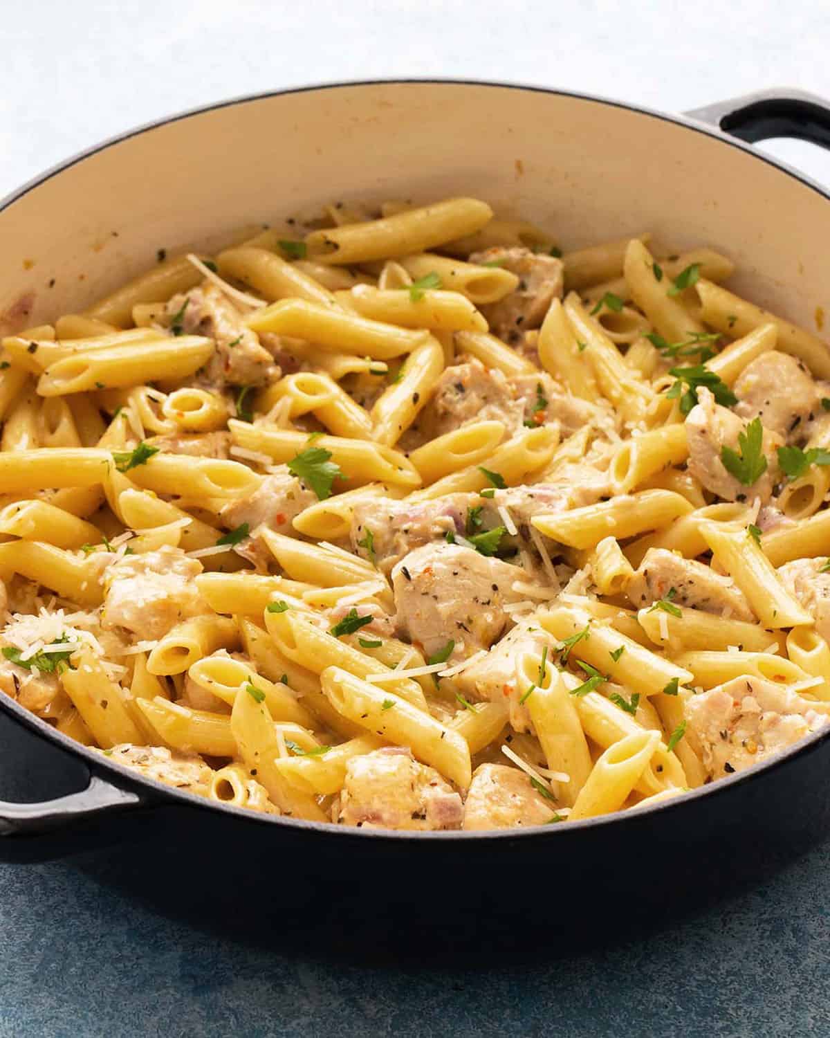 lemon chicken pasta in a large white pan.