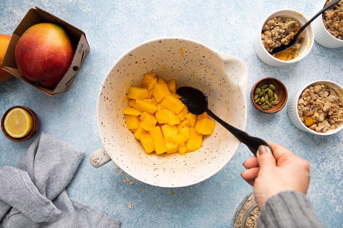 stirring chopped fresh mango with sugar and lime juice.