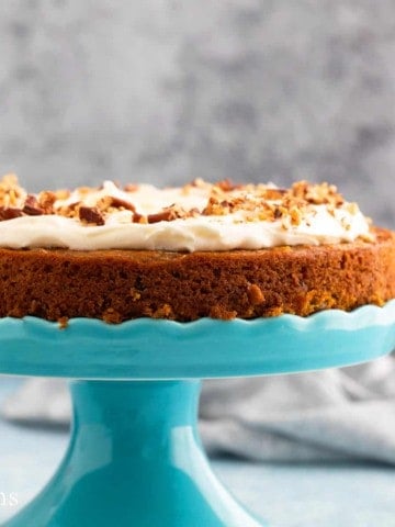 one layer carrot cake on a stand.