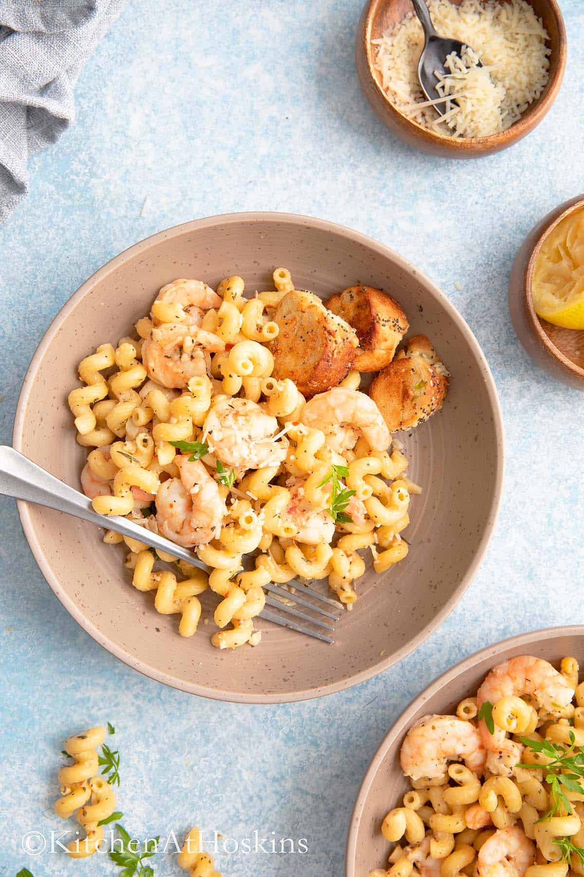 cooked pasta with shrimp and served in a dinner bowls.