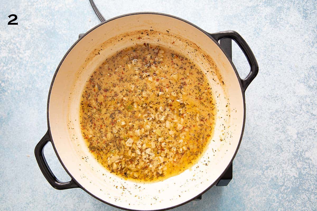 lemon garlic sauce simmering in a white skillet.