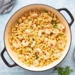 lemon garlic butter shrimp pasta in cast iron pan.