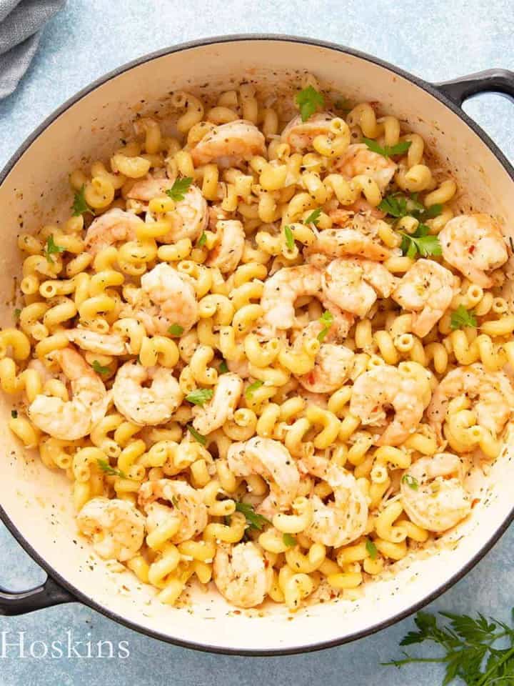 lemon garlic butter shrimp pasta in cast iron pan.