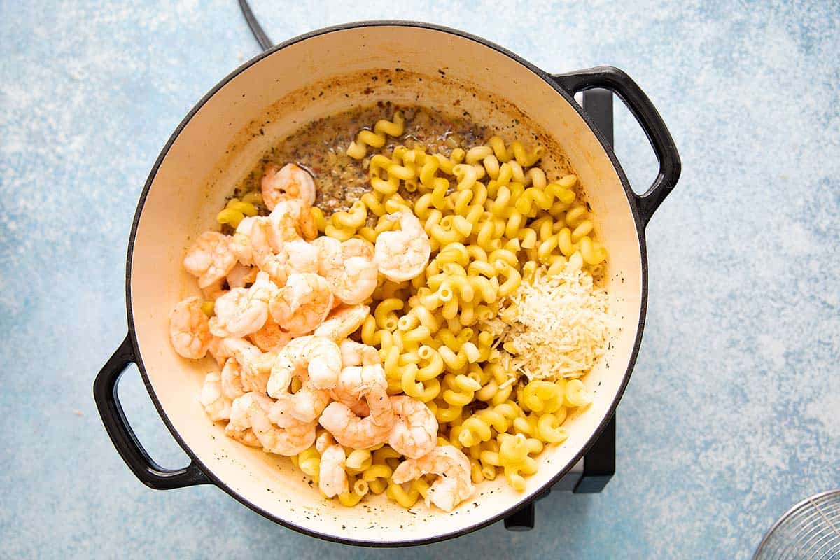 cooked shrimp, pasta and parmesan cheese added to the lemon butter sauce.