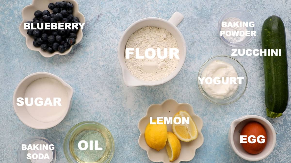 ingredients needed to make zucchini blueberry muffins.