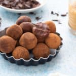 chocolate almond butter truffles on a pan.