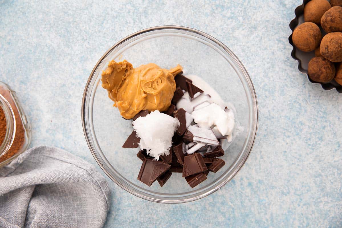 almond butter, chocolate, coconut oil and milk in a glass bowl. 