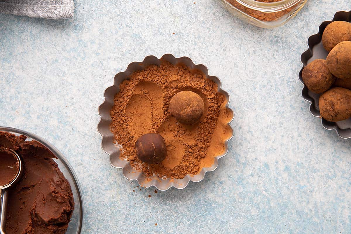 4 ingredient truffles rolled in a pan with cocoa powder. 