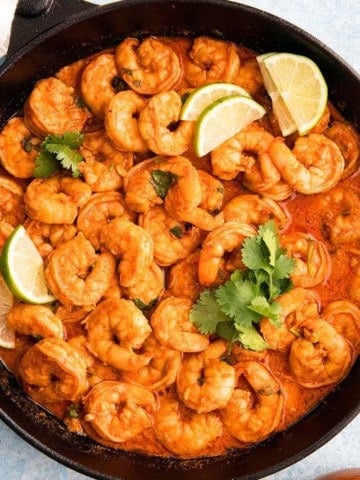 skillet with shrimp in chili lime sauce.