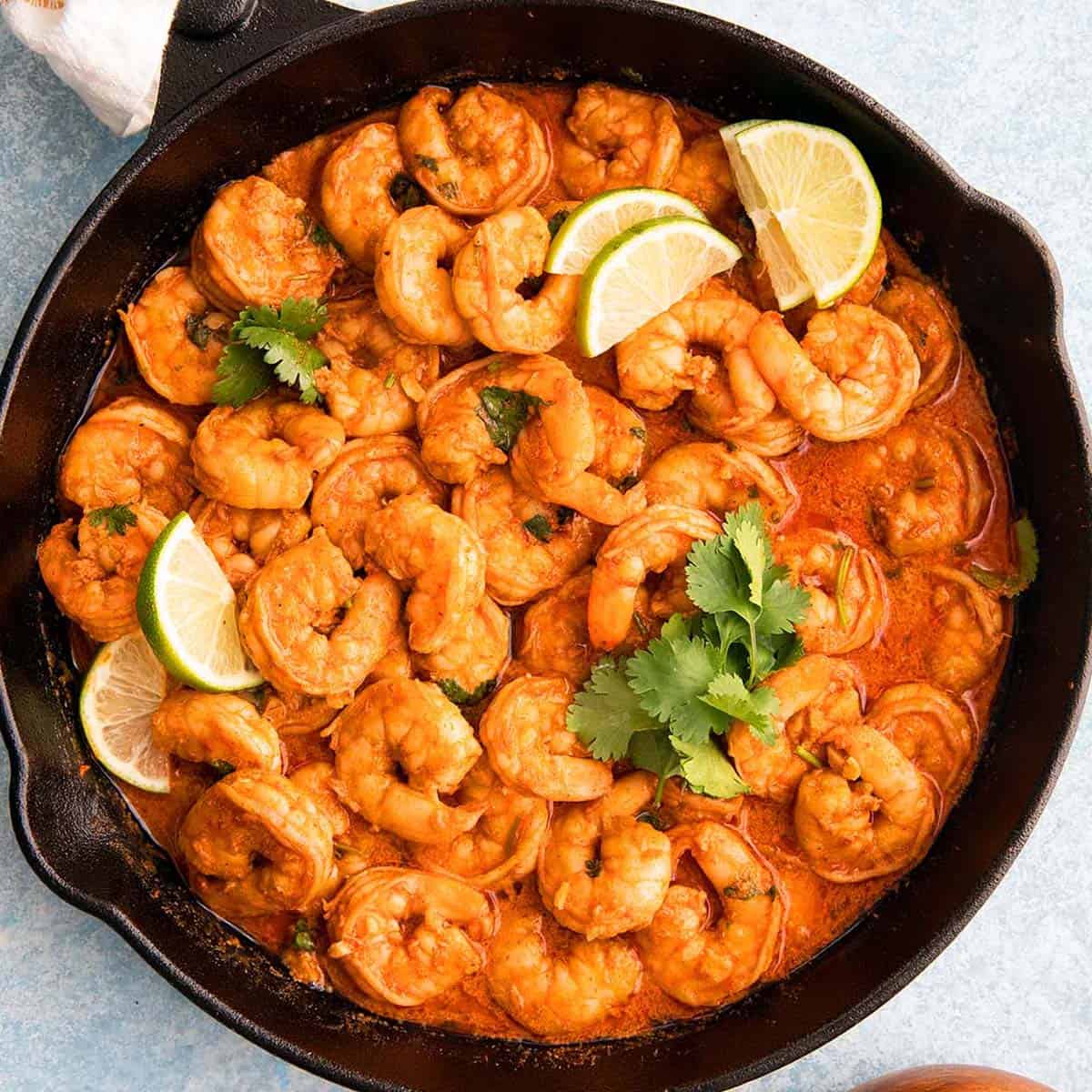 skillet with shrimp in chili lime sauce.