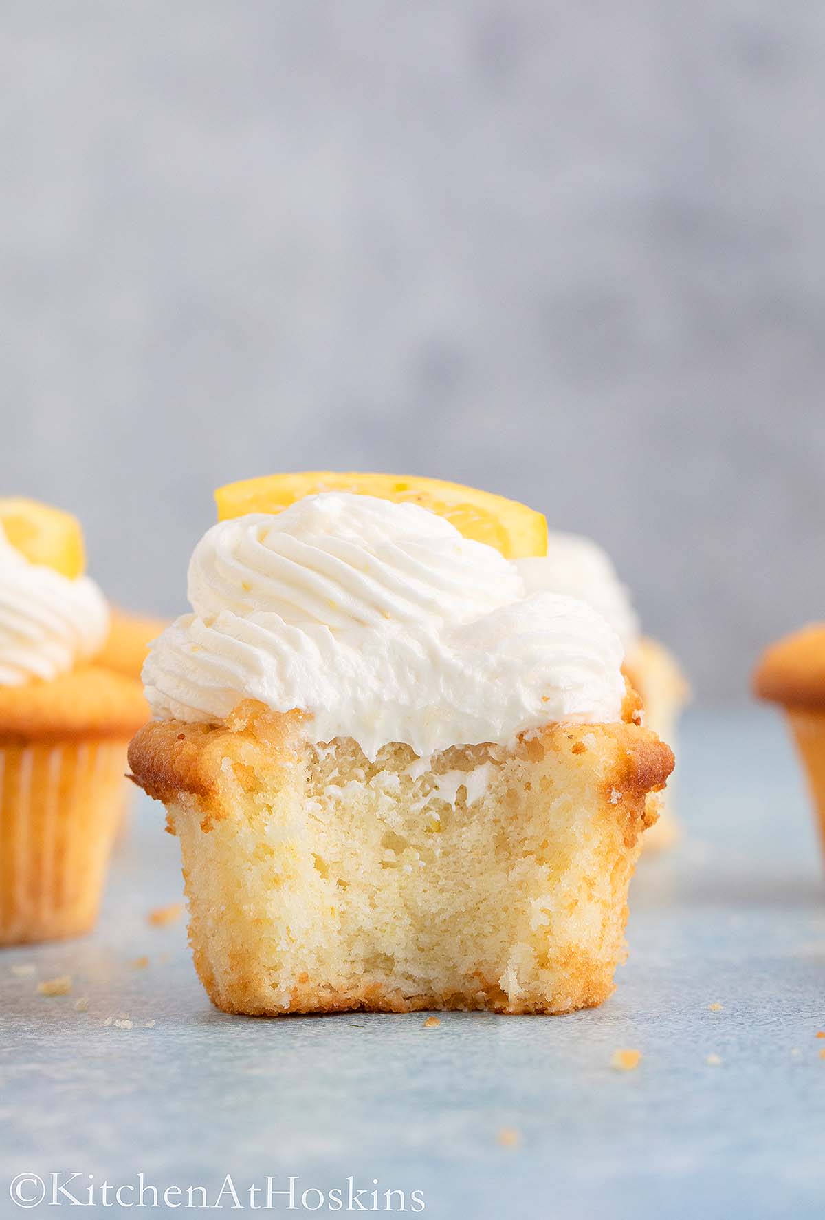 soft lemon cupcake topped with lemon frosting.