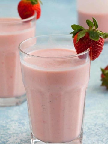 glasses filled with strawberry lassi.