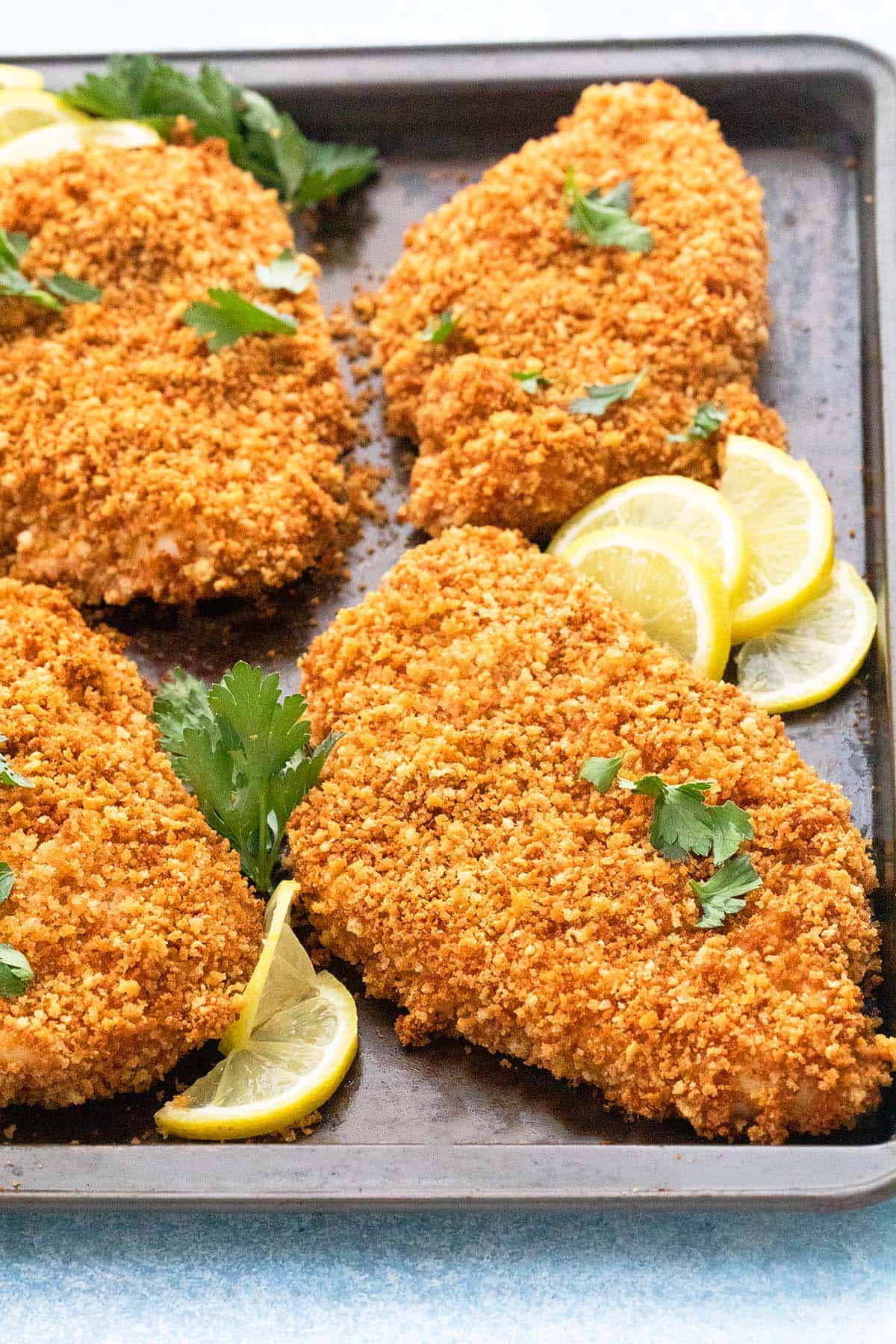 baking pan with panko breaded chicken cutlets.