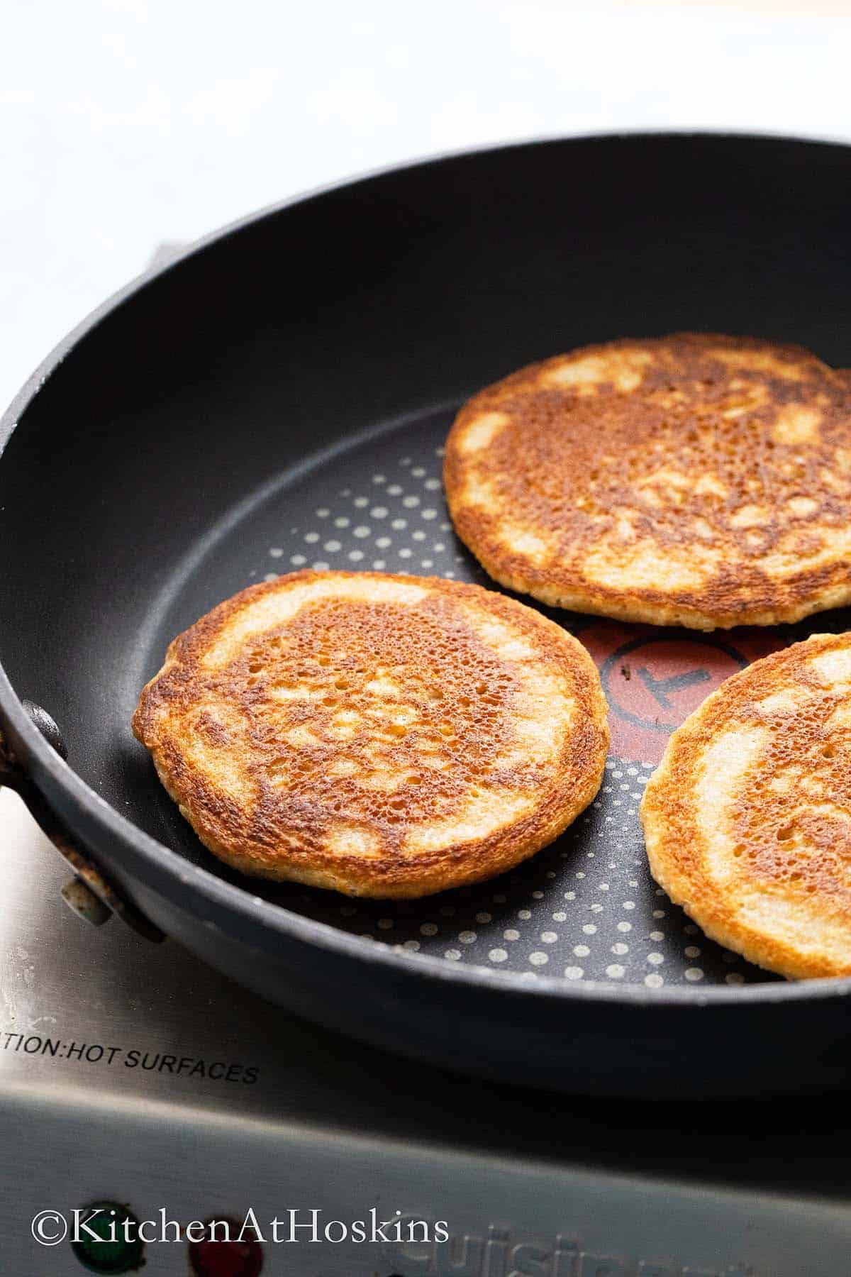 cooked healthy oat pancakes in a non stick skillet.