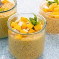 mango chia pudding in glass jars.