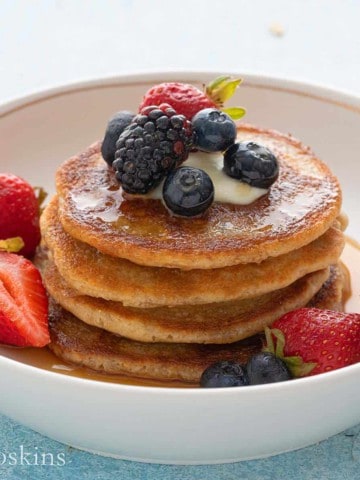 white plate with healthy pancakes made with oat flour.