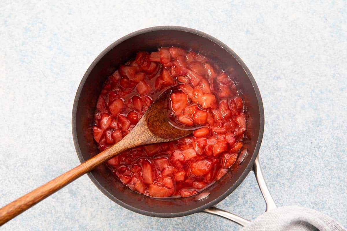 cooked strawberry pulp in a sauce pan. 