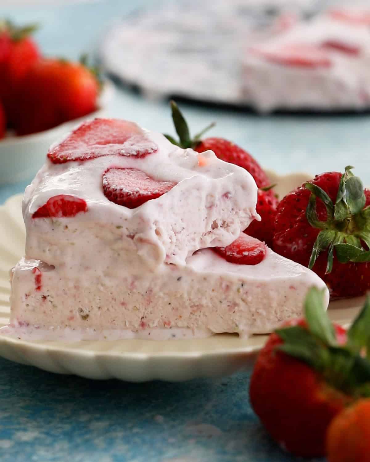 pink strawberry kulfi ice cream on a white plate.