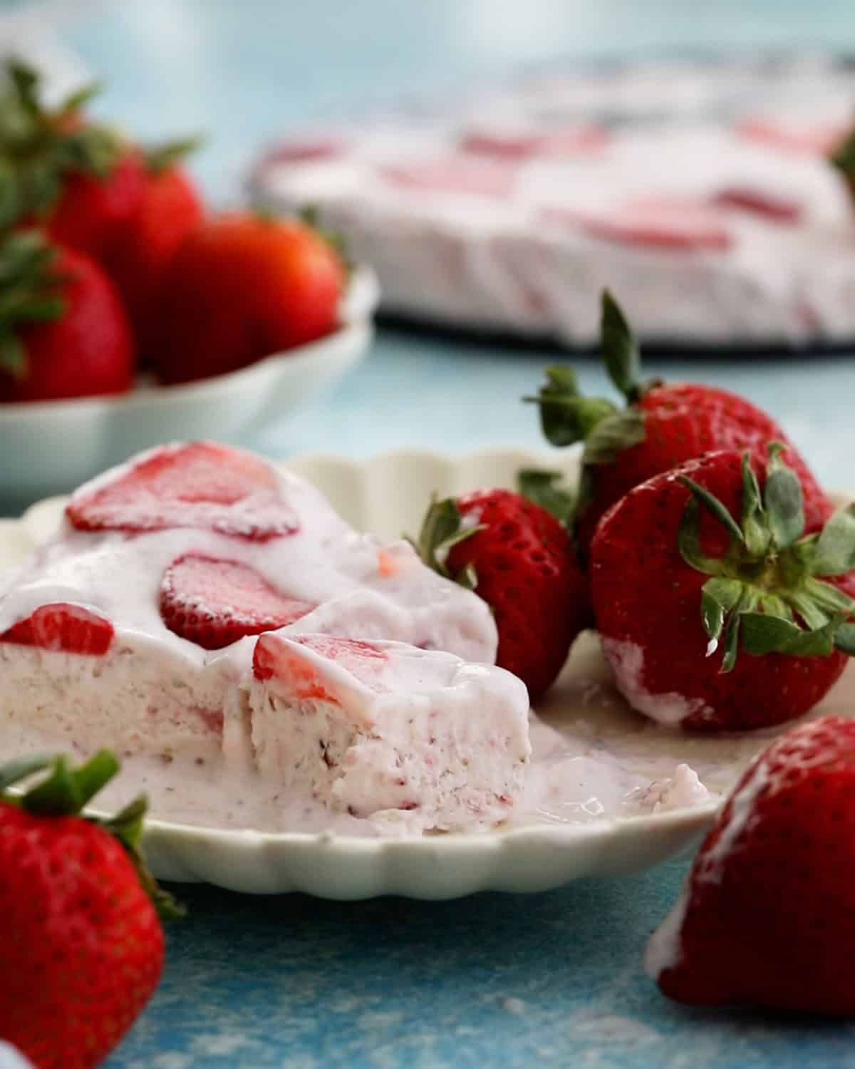 pink strawberry icecream on a white plate.