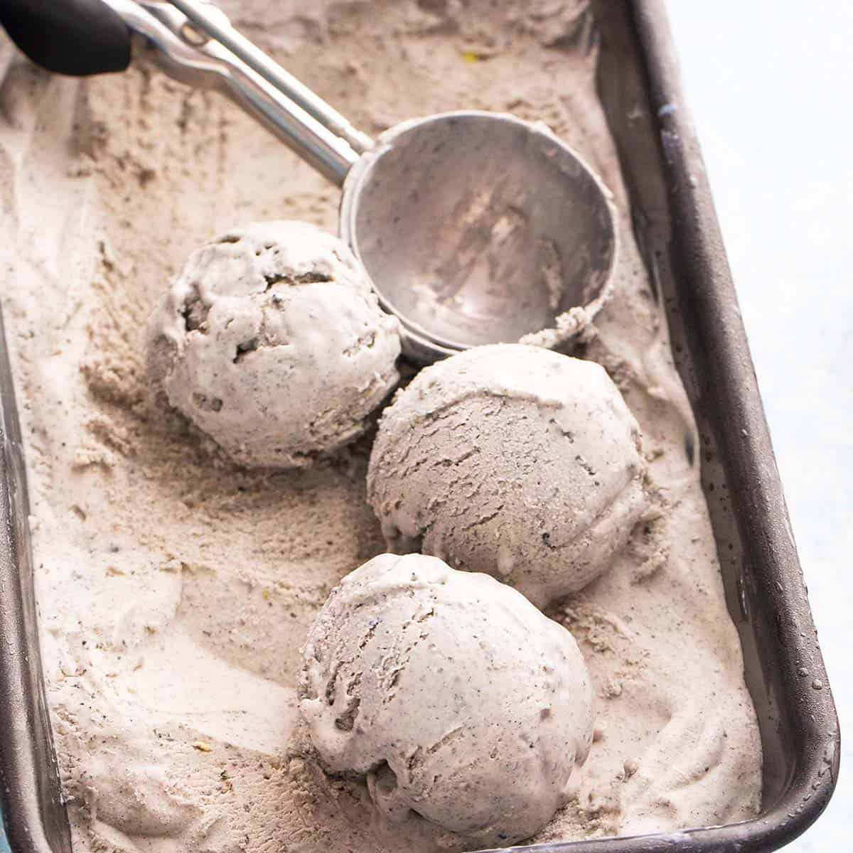 scooped black sesame ice cream in a loaf pan.