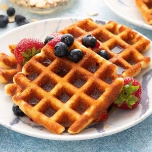 two square waffles placed on a white plate.