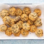 almond flour black sesame seed cookies in a white tray.