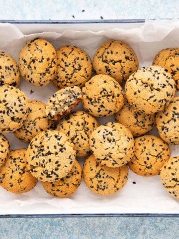 almond flour black sesame seed cookies in a white tray.