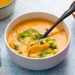 chicken and rice soup in a white bowl.