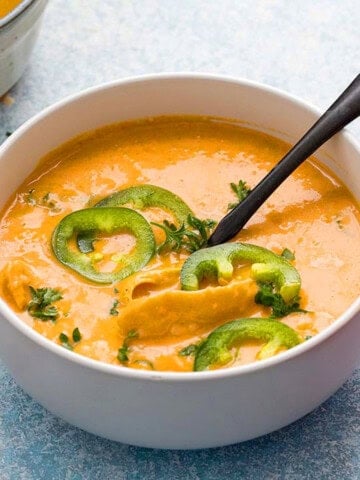 chicken and rice soup in a white bowl.
