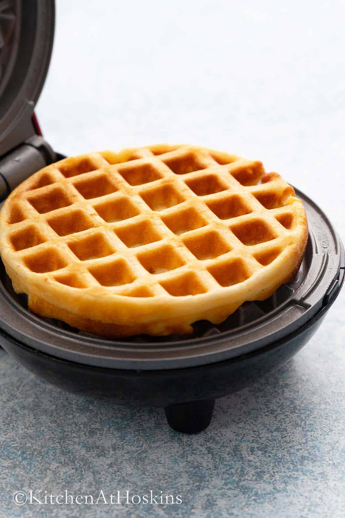 a hot cooked waffle on a dash waffle maker.