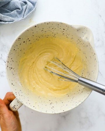 waffle batter in a white bowl.