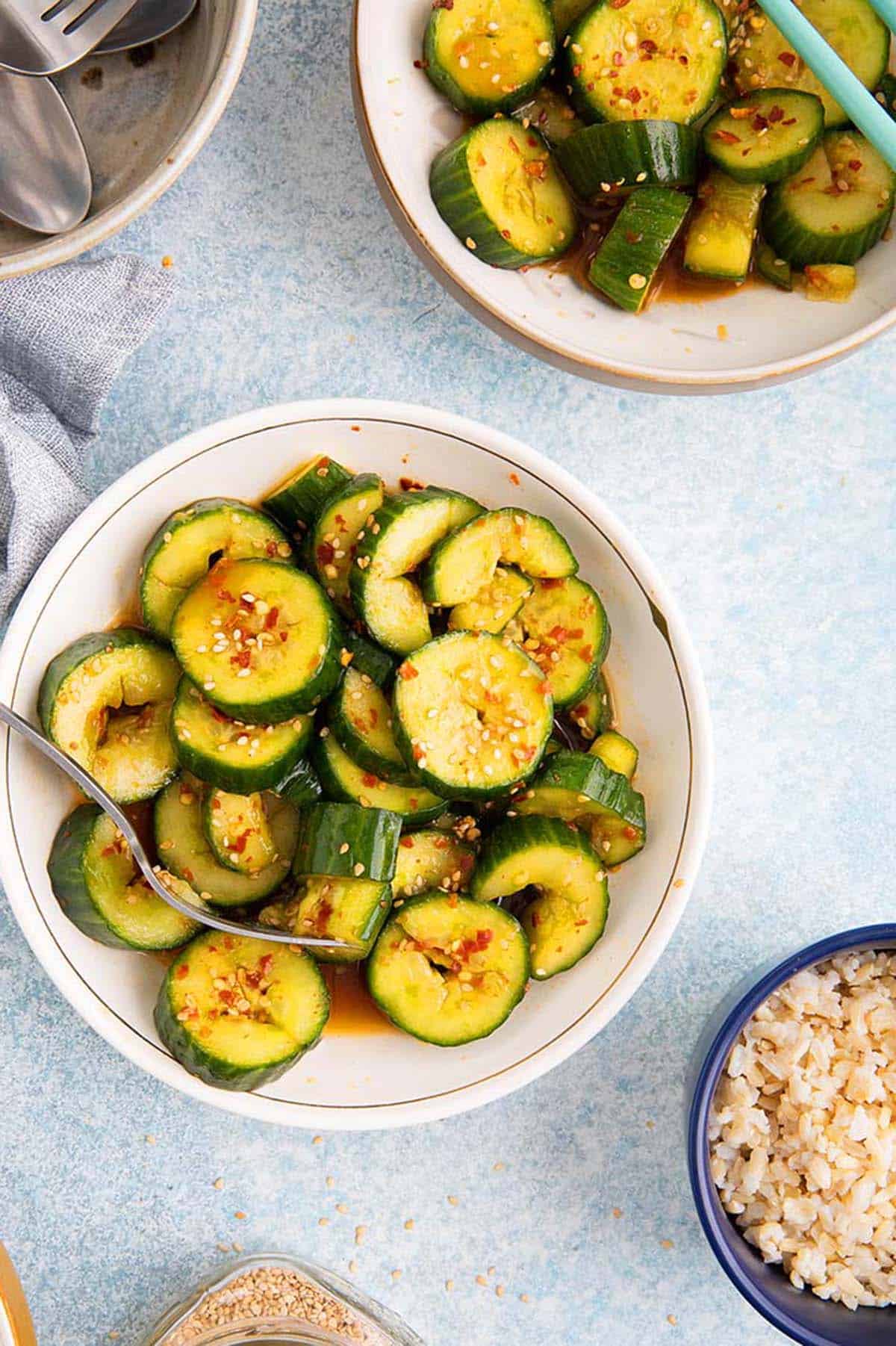 bowls with spicy Asian marinated cucumber salad.