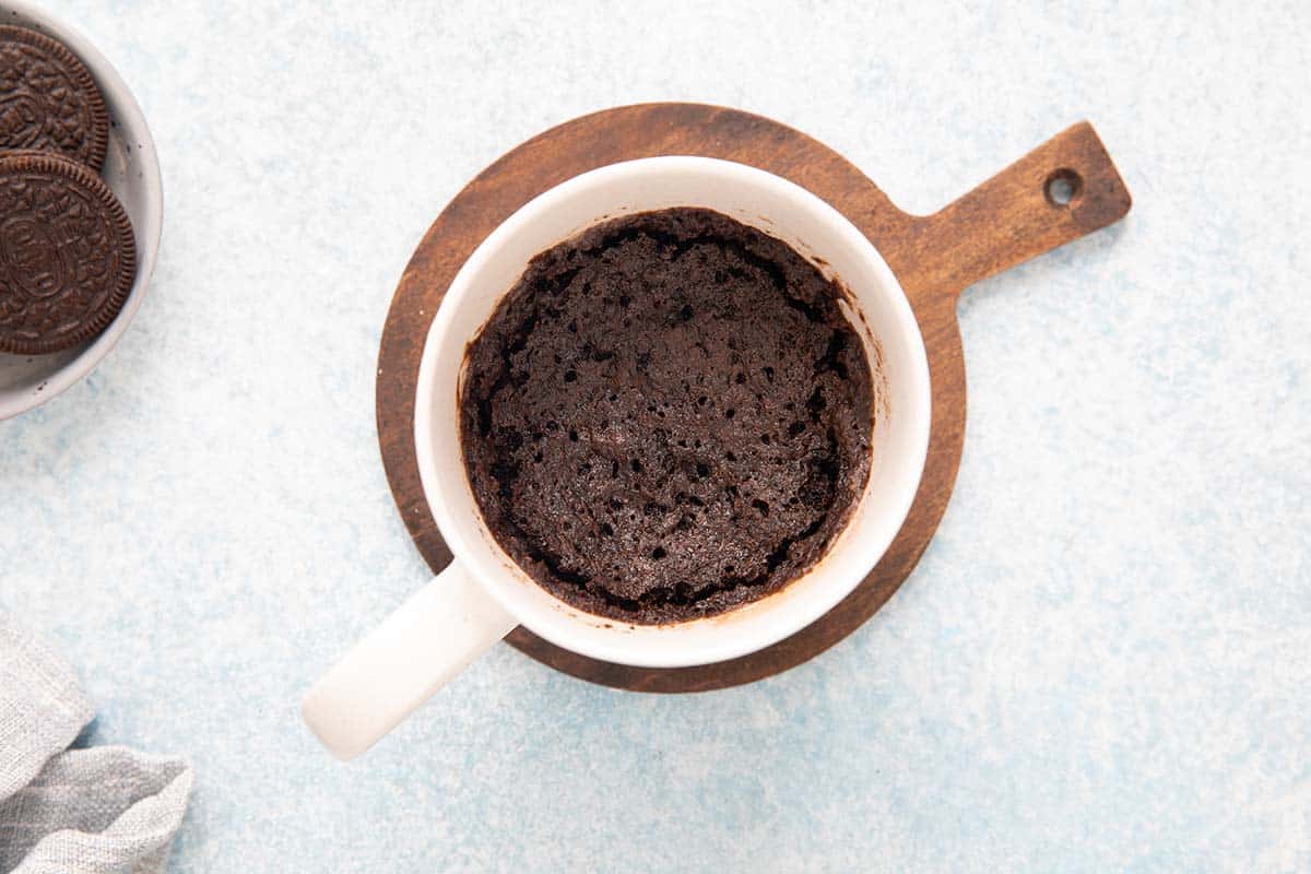cooked chocolate cake in a mug.