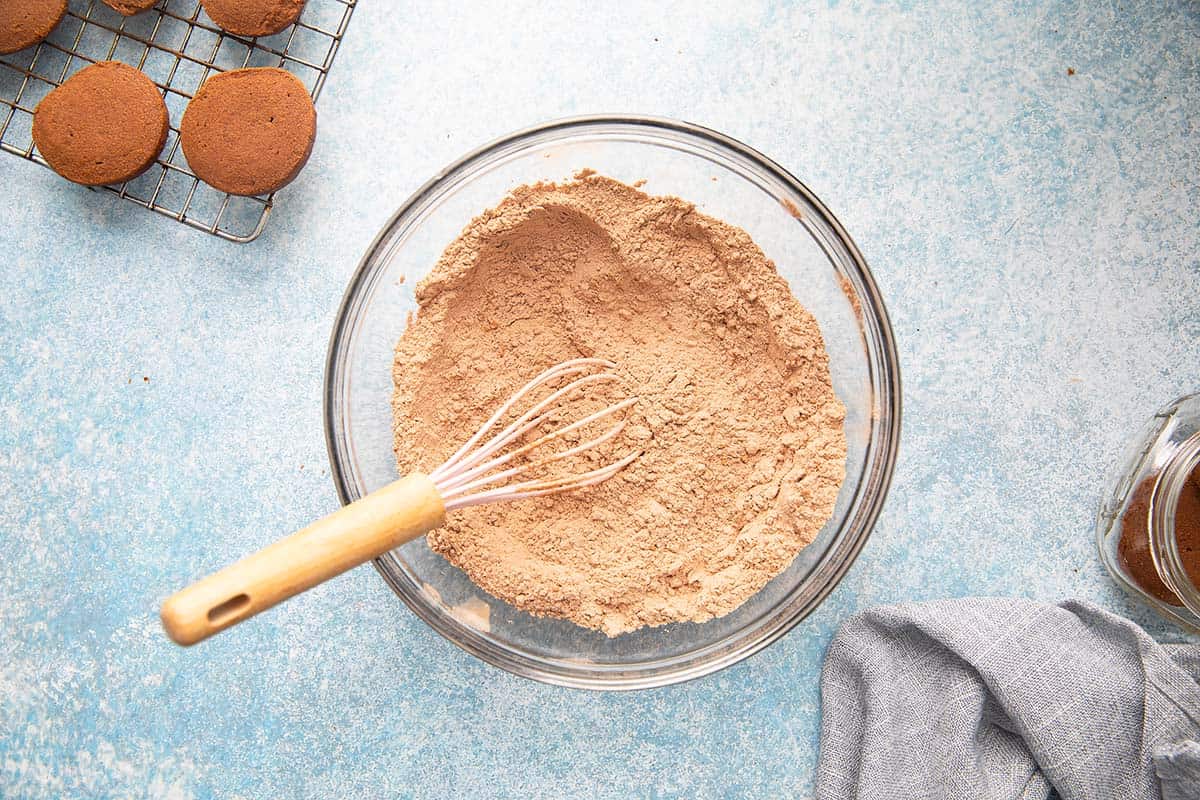 whisked flour and cocoa powder in a bowl with a whisk.