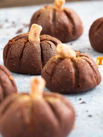 no bake halloween chocolate pumpkins on a board.