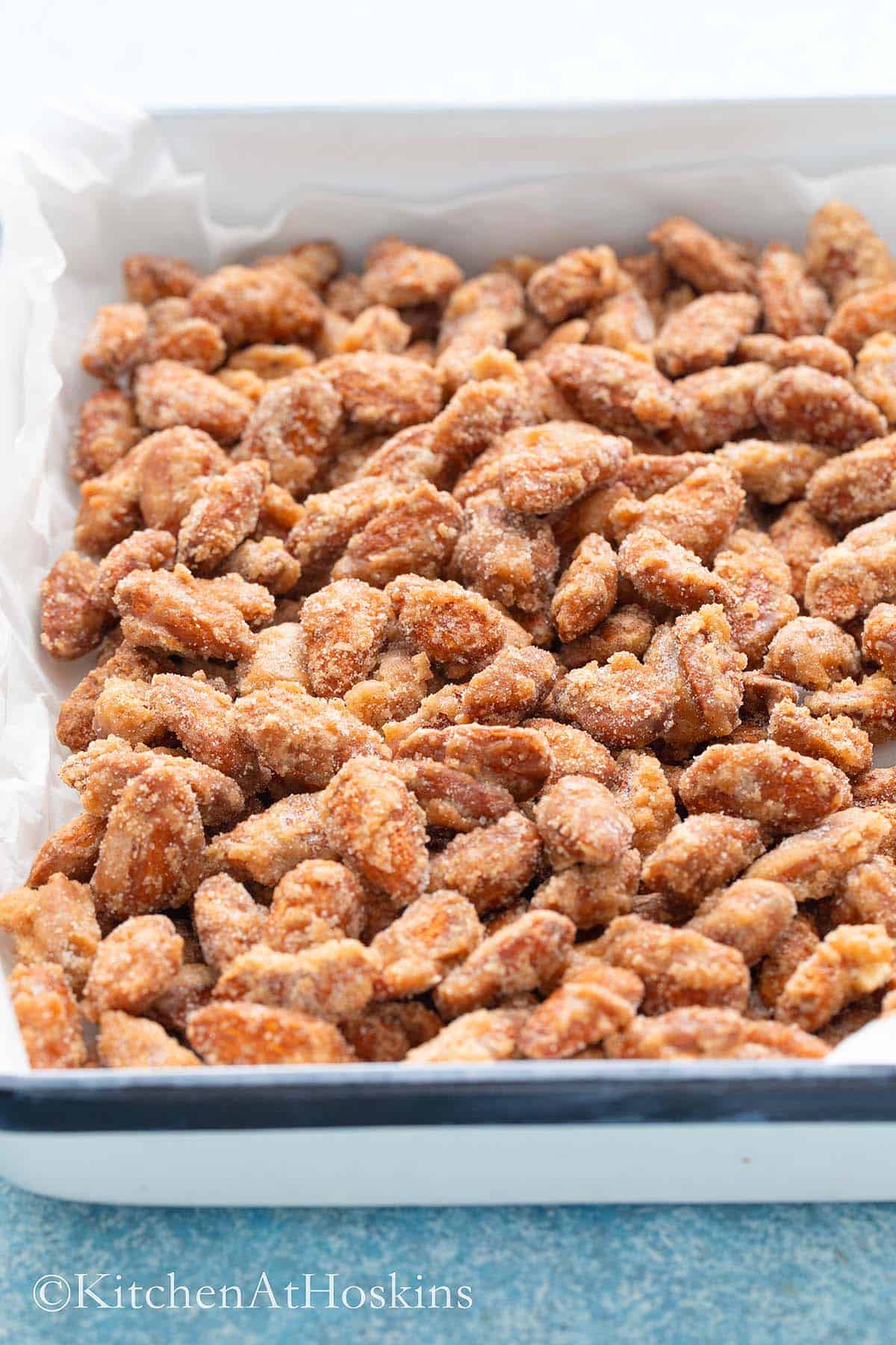 white tray filled with sugar coated almonds.