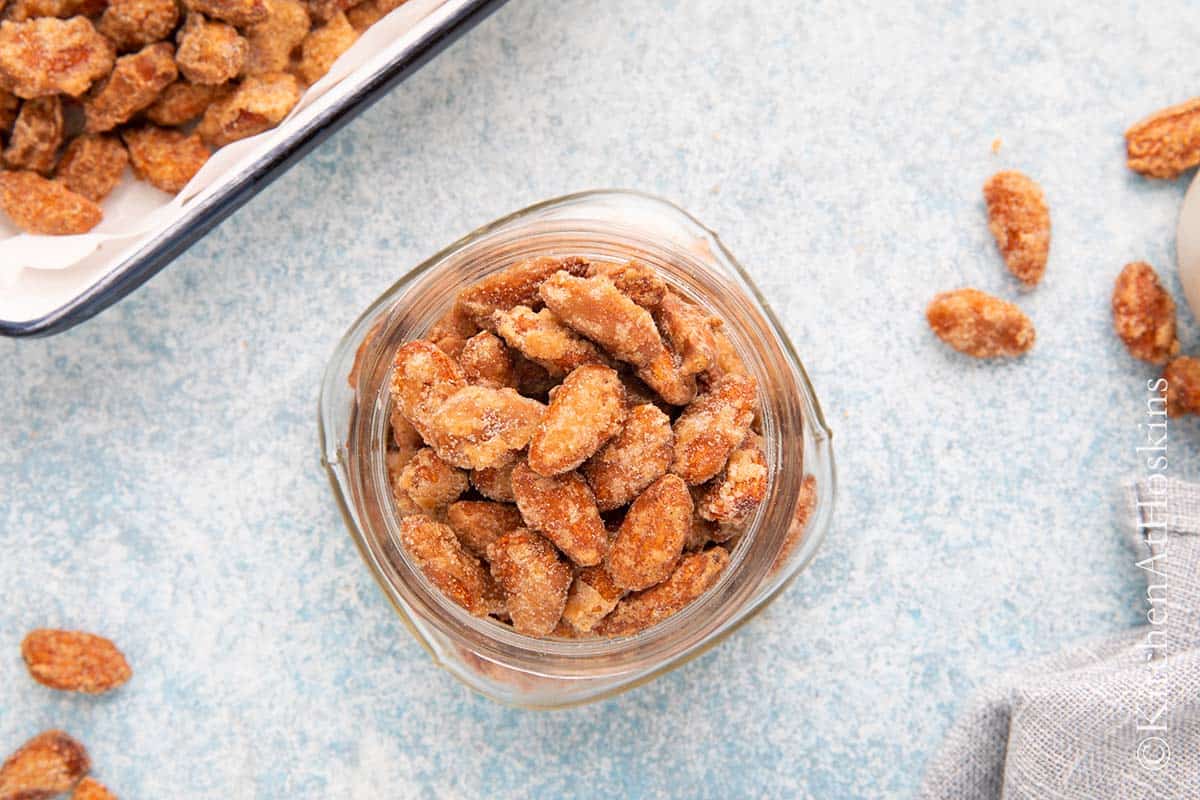 glass mason jar filled with candied almonds.