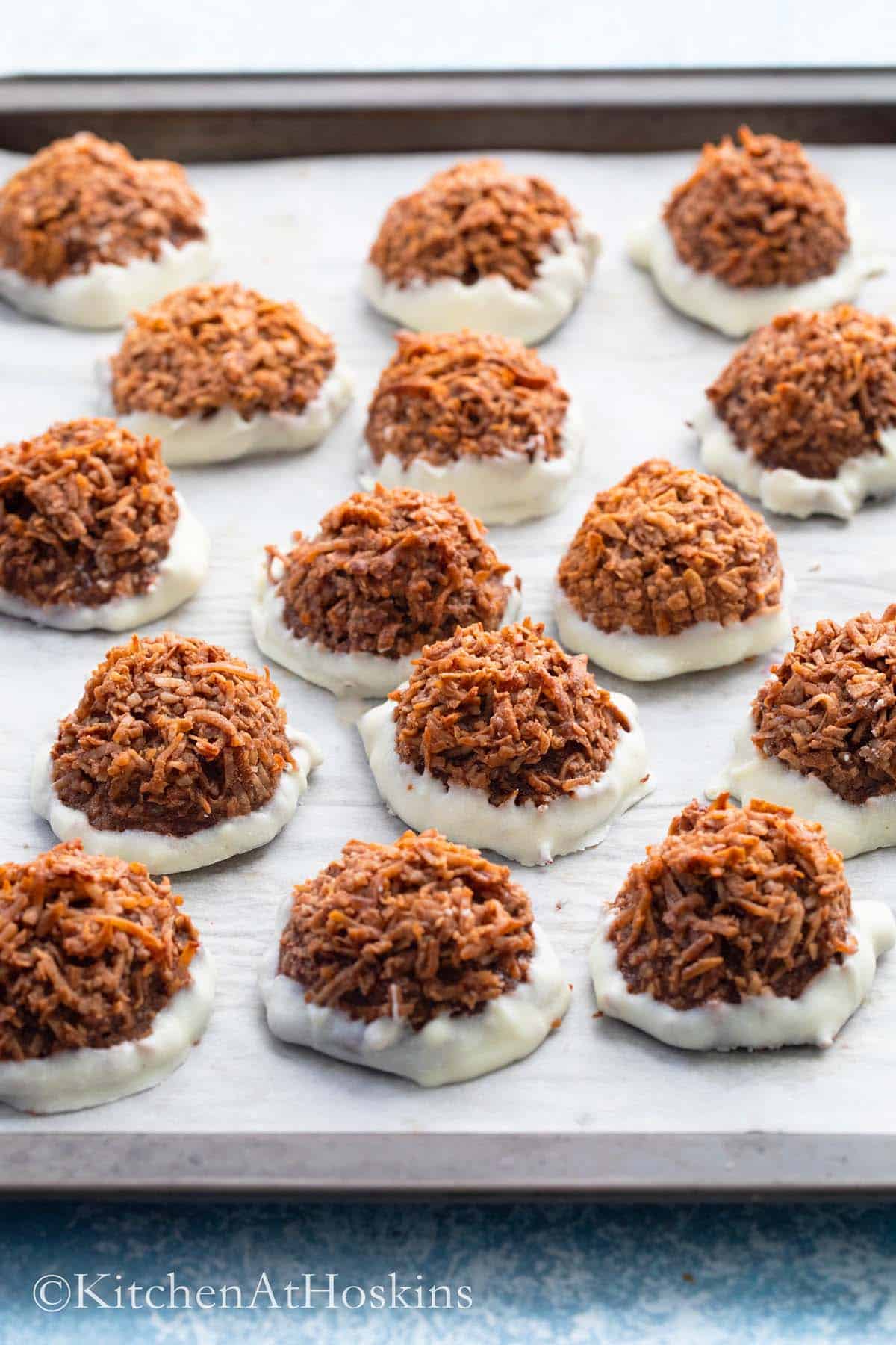 chocolate coconut macaroons placed on a baking sheet.