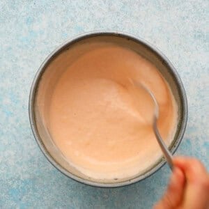 pink shrimp taco sauce in a blue bowl.
