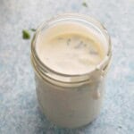 white yogurt sauce in a glass jar.