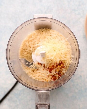 white parmesan cheese, breadcrumbs and red pepper flakes in a small food processor.