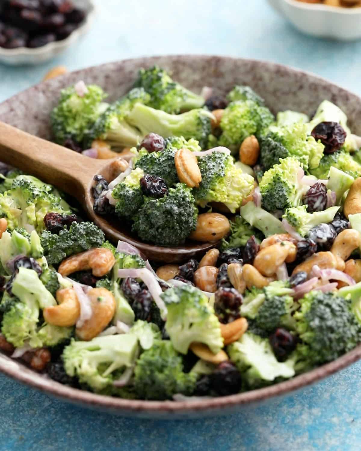 broccoli salad in a brown bowl.