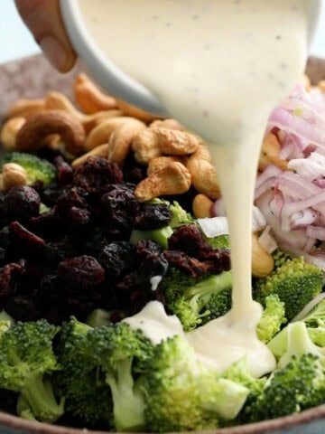 broccoli cranberry salad in a brown bowl.