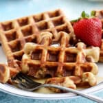 two healthy waffles on a white plate.